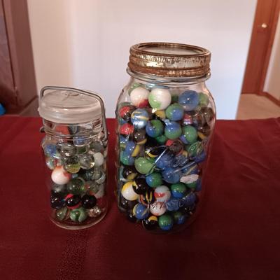1 QUART JAR AND A SMALLER JAR OF MARBLES