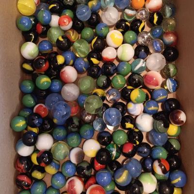 1 QUART JAR AND A SMALLER JAR OF MARBLES