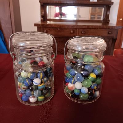 2 JARS OF MISC MARBLES