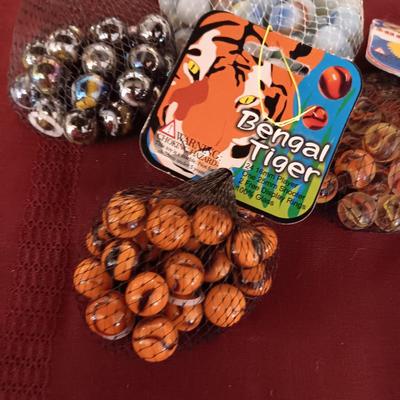4 UNOPENED BAGS OF MARBLES