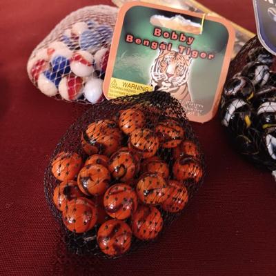 4 BAGS OF UNOPENED MARBLES