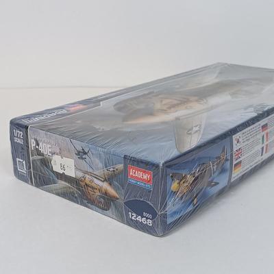 LOT 41: Tom Clark 'The Aviator' 1984 Signed Figurine with NIB Academy P-40E Model Kit & Frank Capra's WWII Documentary...