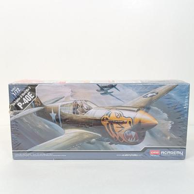 LOT 41: Tom Clark 'The Aviator' 1984 Signed Figurine with NIB Academy P-40E Model Kit & Frank Capra's WWII Documentary...