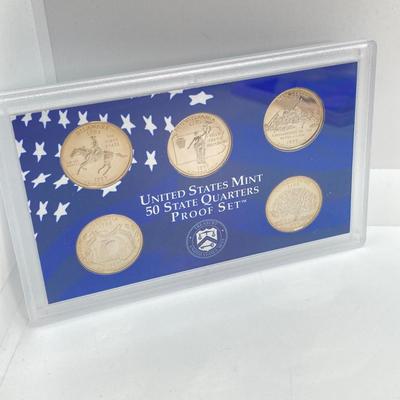 LOT 74: Two 1999 United States Mint Proof Sets and One 1999 United States Mint 50 State Quarters Proof Set