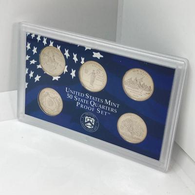 LOT 74: Two 1999 United States Mint Proof Sets and One 1999 United States Mint 50 State Quarters Proof Set