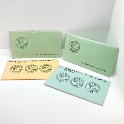 LOT 75: Four US Souvenir Coin Sets - Two 1979 Susan B. Anthony $1 Dollar Coin Sets and Two 1980 Susan B. Anthony $1 Dollar Coin Sets...