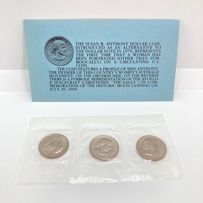 LOT 75: Four US Souvenir Coin Sets - Two 1979 Susan B. Anthony $1 Dollar Coin Sets and Two 1980 Susan B. Anthony $1 Dollar Coin Sets...