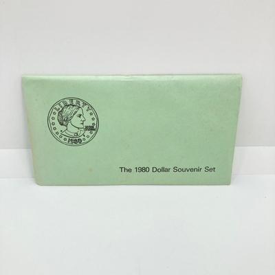 LOT 75: Four US Souvenir Coin Sets - Two 1979 Susan B. Anthony $1 Dollar Coin Sets and Two 1980 Susan B. Anthony $1 Dollar Coin Sets...