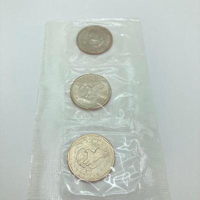 LOT 75: Four US Souvenir Coin Sets - Two 1979 Susan B. Anthony $1 Dollar Coin Sets and Two 1980 Susan B. Anthony $1 Dollar Coin Sets...