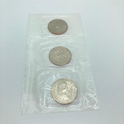 LOT 75: Four US Souvenir Coin Sets - Two 1979 Susan B. Anthony $1 Dollar Coin Sets and Two 1980 Susan B. Anthony $1 Dollar Coin Sets...