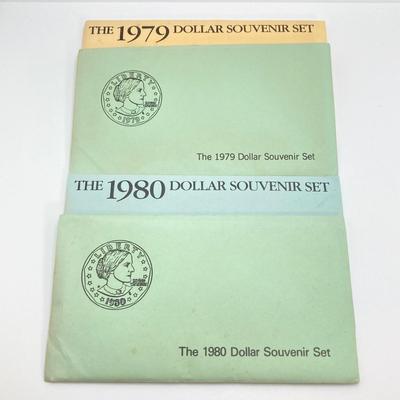 LOT 75: Four US Souvenir Coin Sets - Two 1979 Susan B. Anthony $1 Dollar Coin Sets and Two 1980 Susan B. Anthony $1 Dollar Coin Sets...
