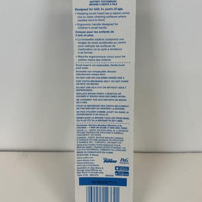 LOT 86: NIP Rug Rats Squeezable Tommy Light, NIP Oral-B Disney's Doc McStuffins Power Toothbrush, Winnie the Pooh Read Out-ALoud...