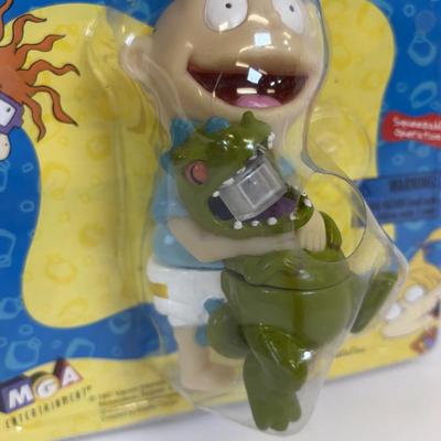 LOT 86: NIP Rug Rats Squeezable Tommy Light, NIP Oral-B Disney's Doc McStuffins Power Toothbrush, Winnie the Pooh Read Out-ALoud...