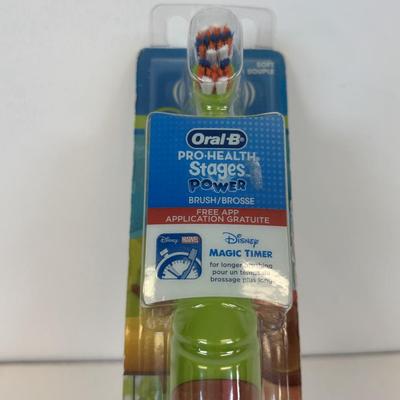 LOT 86: NIP Rug Rats Squeezable Tommy Light, NIP Oral-B Disney's Doc McStuffins Power Toothbrush, Winnie the Pooh Read Out-ALoud...