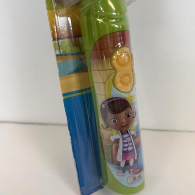 LOT 86: NIP Rug Rats Squeezable Tommy Light, NIP Oral-B Disney's Doc McStuffins Power Toothbrush, Winnie the Pooh Read Out-ALoud...