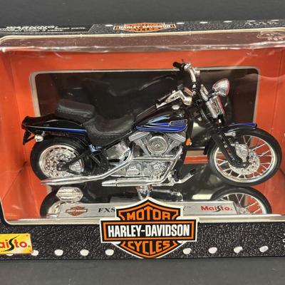 LOT 94: Harley Davidson Collection: Dept 56, Maisto FXSTSB Bad Boy & FLHR Road King Diecast Replicas, NIP Timer Cover & Ornaments