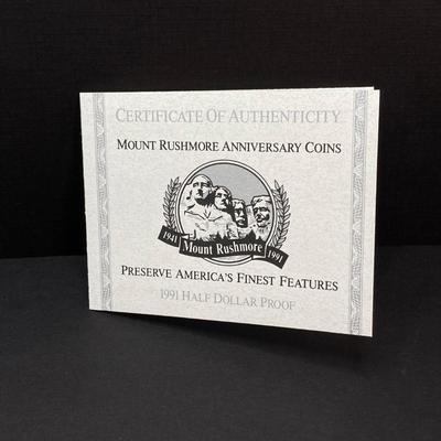LOT 100: 1991 United States Mount Rushmore Anniversary Half Dollar Proof Coin with Presentation Box and Certificate of Authenticity