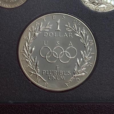 LOT 103: United States Mint 1988 Prestige Set with 1988 U.S. Olympic Silver Dollar in Presentation Book with Certificate of Authenticity