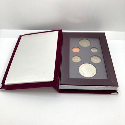 LOT 103: United States Mint 1988 Prestige Set with 1988 U.S. Olympic Silver Dollar in Presentation Book with Certificate of Authenticity