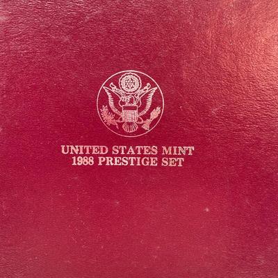 LOT 103: United States Mint 1988 Prestige Set with 1988 U.S. Olympic Silver Dollar in Presentation Book with Certificate of Authenticity