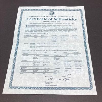 LOT 104: United States Mint 1990 Prestige Set with 1990 Eisenhower Centennial Silver Dollar in Presentation Book with Certificate of...