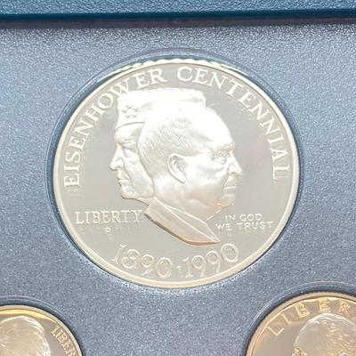 LOT 104: United States Mint 1990 Prestige Set with 1990 Eisenhower Centennial Silver Dollar in Presentation Book with Certificate of...