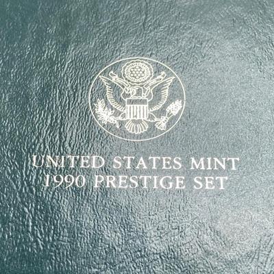 LOT 104: United States Mint 1990 Prestige Set with 1990 Eisenhower Centennial Silver Dollar in Presentation Book with Certificate of...
