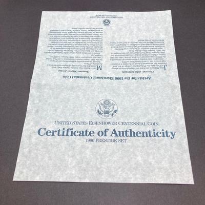 LOT 104: United States Mint 1990 Prestige Set with 1990 Eisenhower Centennial Silver Dollar in Presentation Book with Certificate of...