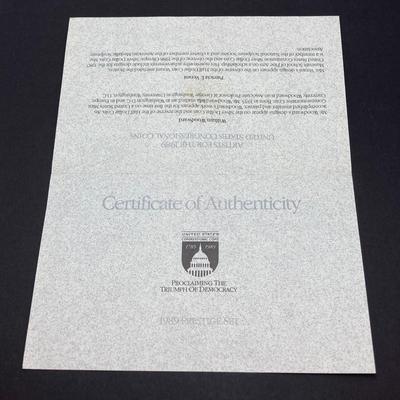 LOT 105: United States Mint 1989 Prestige Set with 1989 Congressional Silver Dollar and Half Dollar in Presentation Book with Certificate...