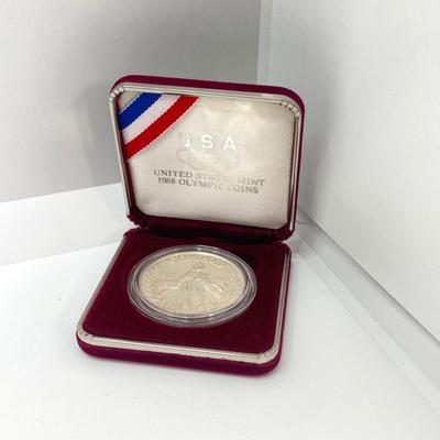 LOT 106: United States Mint 1988 Olympic Silver Dollar Proof Coin with Presentation Box and Certificate of Authenticity