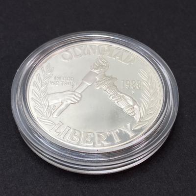 LOT 106: United States Mint 1988 Olympic Silver Dollar Proof Coin with Presentation Box and Certificate of Authenticity