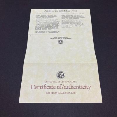 LOT 106: United States Mint 1988 Olympic Silver Dollar Proof Coin with Presentation Box and Certificate of Authenticity