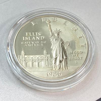 LOT 110: Pair of 1986 United States Liberty Coin Sets with Silver Dollar Coins in Presentation Boxes with Certificate of Authenticity