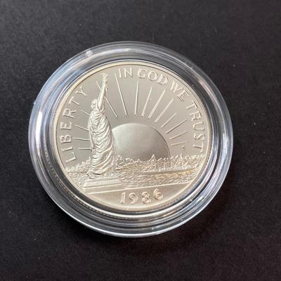 LOT 110: Pair of 1986 United States Liberty Coin Sets with Silver Dollar Coins in Presentation Boxes with Certificate of Authenticity