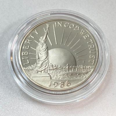 LOT 110: Pair of 1986 United States Liberty Coin Sets with Silver Dollar Coins in Presentation Boxes with Certificate of Authenticity