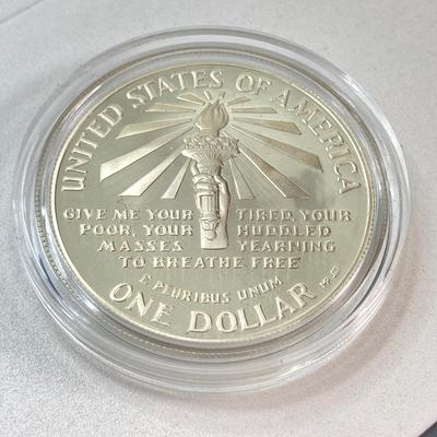 LOT 110: Pair of 1986 United States Liberty Coin Sets with Silver Dollar Coins in Presentation Boxes with Certificate of Authenticity