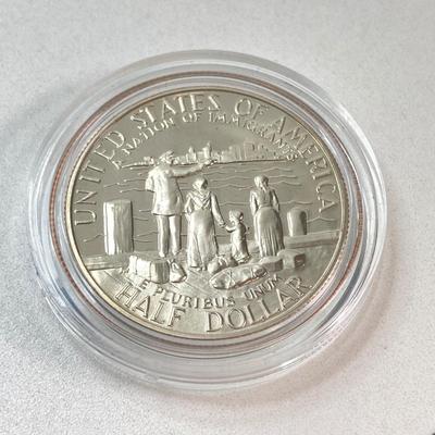 LOT 110: Pair of 1986 United States Liberty Coin Sets with Silver Dollar Coins in Presentation Boxes with Certificate of Authenticity