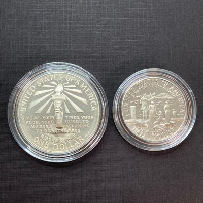 LOT 110: Pair of 1986 United States Liberty Coin Sets with Silver Dollar Coins in Presentation Boxes with Certificate of Authenticity
