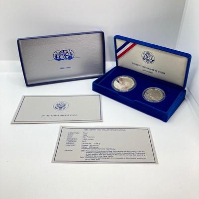 LOT 110: Pair of 1986 United States Liberty Coin Sets with Silver Dollar Coins in Presentation Boxes with Certificate of Authenticity