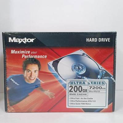 LOT 124: New/Old Stock - Maxtor 200GB Hard Drive, HDTV Hook-Up Kit, PC Analog Joystick & More