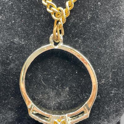 2 interesting gold tone necklaces