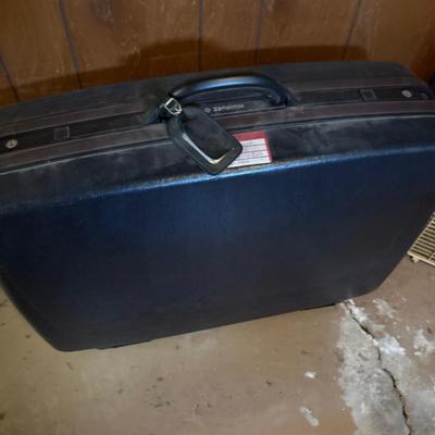 Two clothing, racks, plan, and Samsonite suitcase