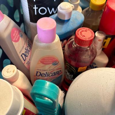 Basket with cleaning supplies & paper towels