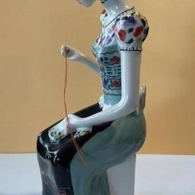 Hungarian Hollohaza Girl Sewing Figurine 9.25" Tall in VG Preowned Condition Preowned from an Estate. Very Nicely Done.