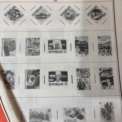 Unused collector stamps, album w/stamped & supplies