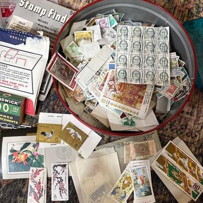Tin of used stamps & some new stamps