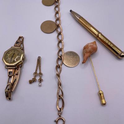 Watch, charcoal pencil and 1/20 12k gold bracelet