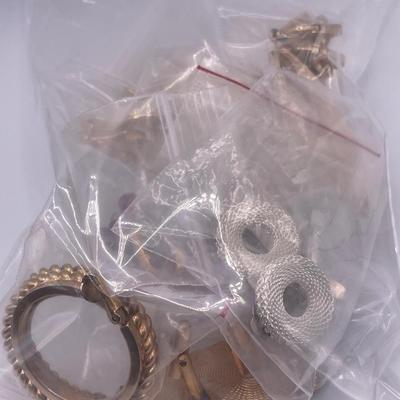 Grab bag of cuff links and clip on earrings