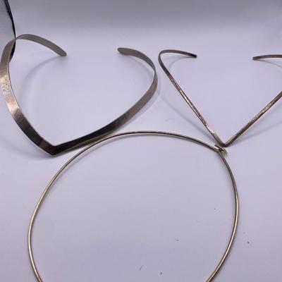 V shaped necklaces and one round