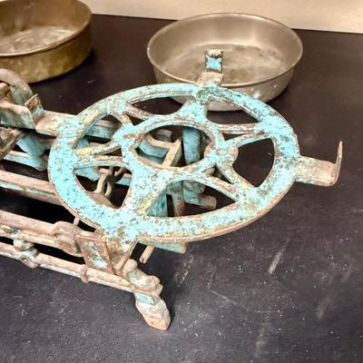 Sale Photo Thumbnail #652: This is a vintage cast iron balance scale with brass pans.